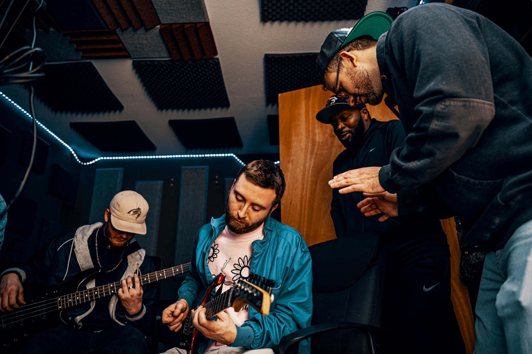 Musicians rehearsing together in a recording studio Musicians rehearsing together in a recording studio with guitars and collaborators